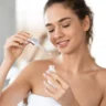 Attractive Lady Applying Facial Serum 1100x